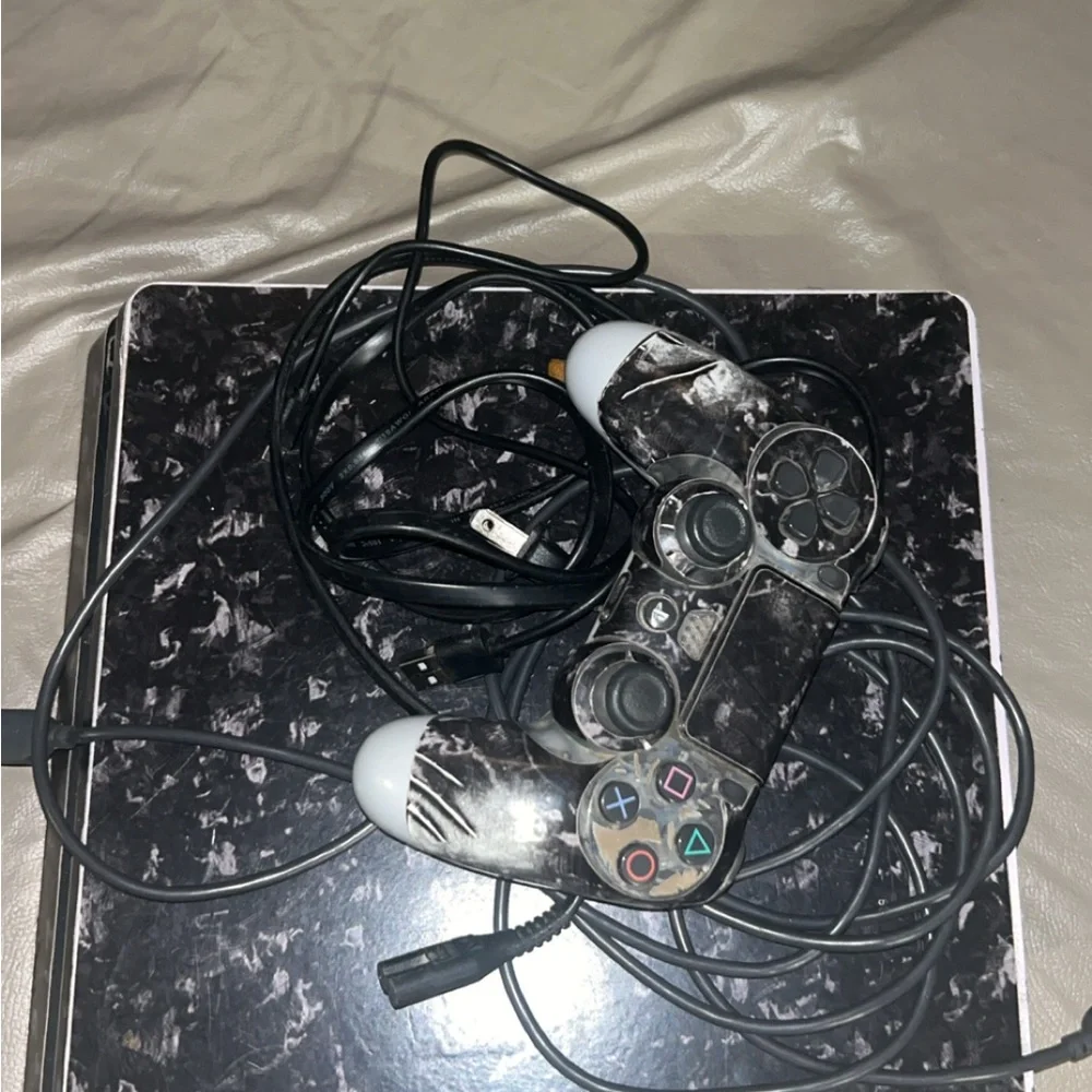 Sony PlayStation Console with Black and White Controller